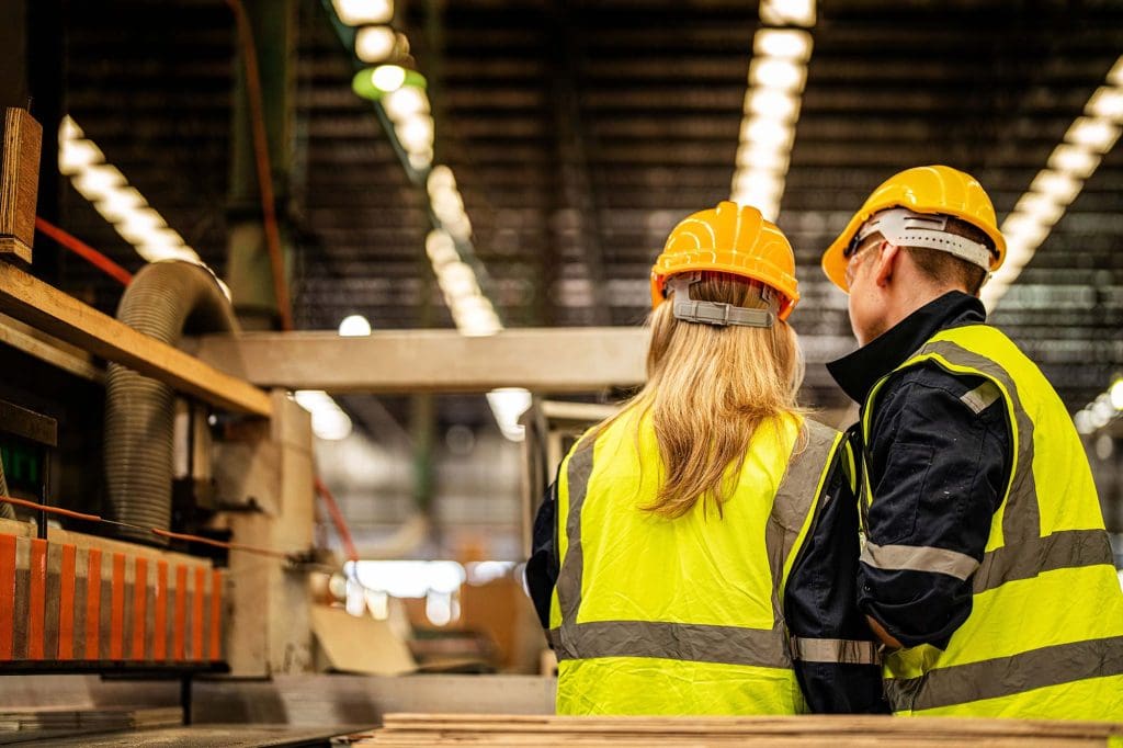 Warehouse worker folding a box during workplace task analysis for ergonomic assessment